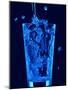 Blue Water Being Poured into Tumbler-null-Mounted Photographic Print