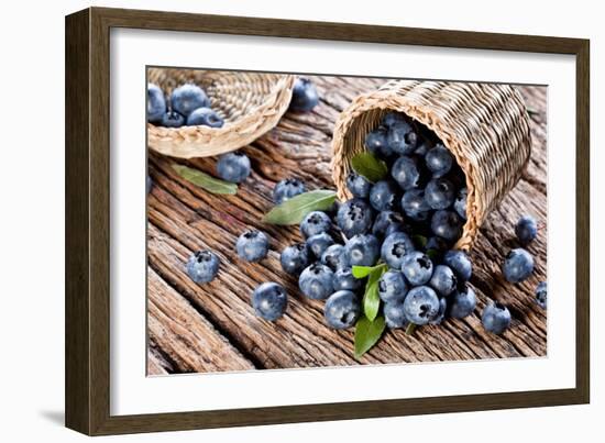 Blueberries Have Dropped from the Basket on an Old Wooden Table.-Volff-Framed Photographic Print