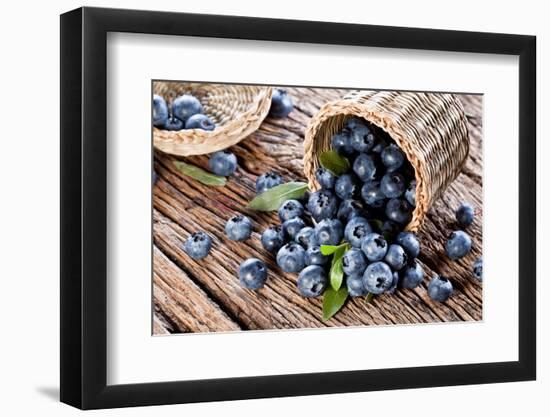 Blueberries Have Dropped from the Basket on an Old Wooden Table.-Volff-Framed Photographic Print