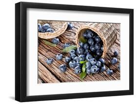 Blueberries Have Dropped from the Basket on an Old Wooden Table.-Volff-Framed Photographic Print