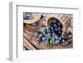 Blueberries Have Dropped from the Basket on an Old Wooden Table.-Volff-Framed Photographic Print