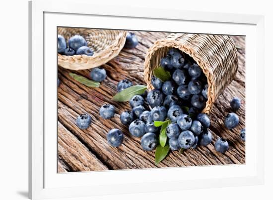 Blueberries Have Dropped from the Basket on an Old Wooden Table.-Volff-Framed Photographic Print