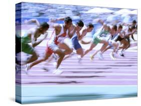 Blured Action at the Start of a Mens 100 Meter Track and Field Race-Paul Sutton-Stretched Canvas