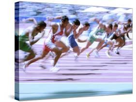 Blured Action at the Start of a Mens 100 Meter Track and Field Race-Paul Sutton-Stretched Canvas