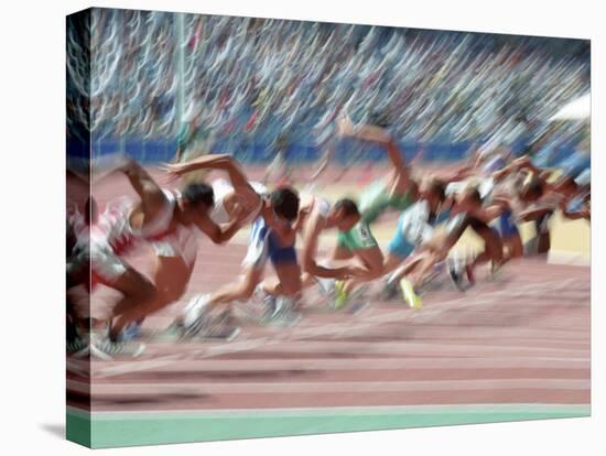 Blured Action at the Start of a Mens 100 Meter Track and Field Race-Paul Sutton-Stretched Canvas