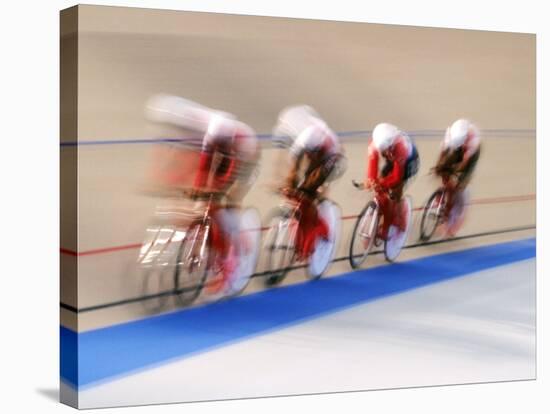 Blurred Action of Cycliing Team Onthe Track-Chris Trotman-Stretched Canvas