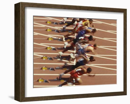 Blurred Action of Male Runners Starting a 100 Meter Sprint Race-Paul Sutton-Framed Photographic Print