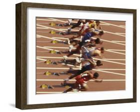 Blurred Action of Male Runners Starting a 100 Meter Sprint Race-Paul Sutton-Framed Photographic Print