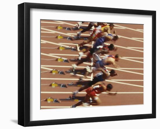 Blurred Action of Male Runners Starting a 100 Meter Sprint Race-Paul Sutton-Framed Photographic Print