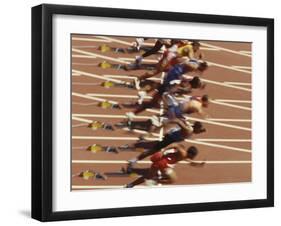 Blurred Action of Male Runners Starting a 100 Meter Sprint Race-Paul Sutton-Framed Photographic Print