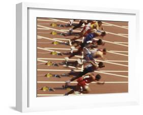 Blurred Action of Male Runners Starting a 100 Meter Sprint Race-Paul Sutton-Framed Photographic Print