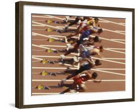 Blurred Action of Male Runners Starting a 100 Meter Sprint Race-Paul Sutton-Framed Photographic Print