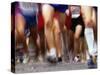 Blurred Action of Runner's Legs Competing in a Race-null-Stretched Canvas