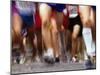 Blurred Action of Runner's Legs Competing in a Race-null-Mounted Photographic Print