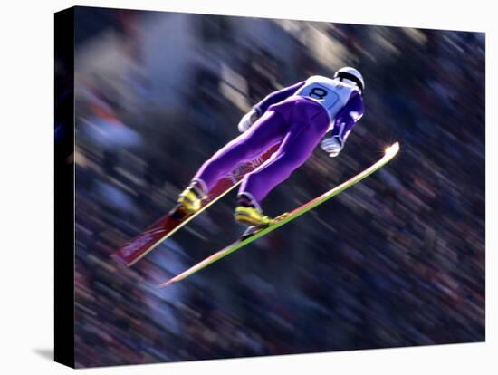 Blurred Action of Ski Jumper Flying Throught the Air-null-Stretched Canvas