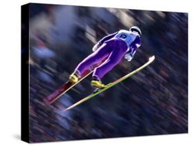 Blurred Action of Ski Jumper Flying Throught the Air-null-Stretched Canvas