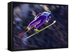 Blurred Action of Ski Jumper Flying Throught the Air-null-Framed Stretched Canvas