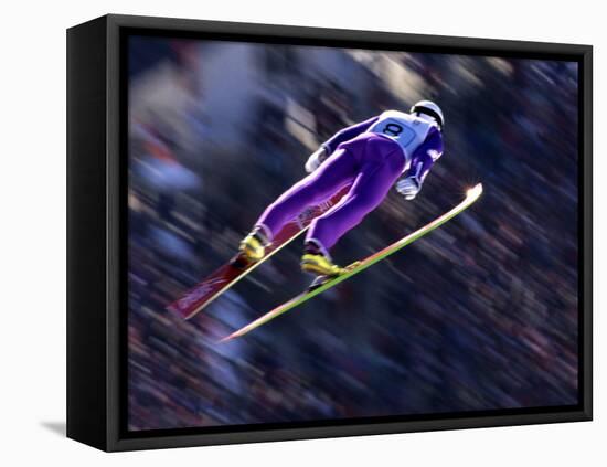 Blurred Action of Ski Jumper Flying Throught the Air-null-Framed Stretched Canvas