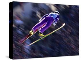 Blurred Action of Ski Jumper Flying Throught the Air-null-Stretched Canvas
