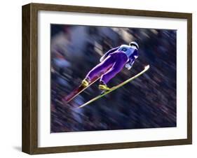 Blurred Action of Ski Jumper Flying Throught the Air-null-Framed Photographic Print