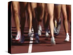 Blurred Action of Women Runners During a Track Race-Steven Sutton-Stretched Canvas