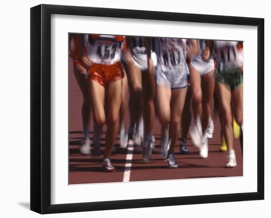 Blurred Action of Women Runners During a Track Race-Steven Sutton-Framed Photographic Print