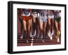 Blurred Action of Women Runners During a Track Race-Steven Sutton-Framed Photographic Print