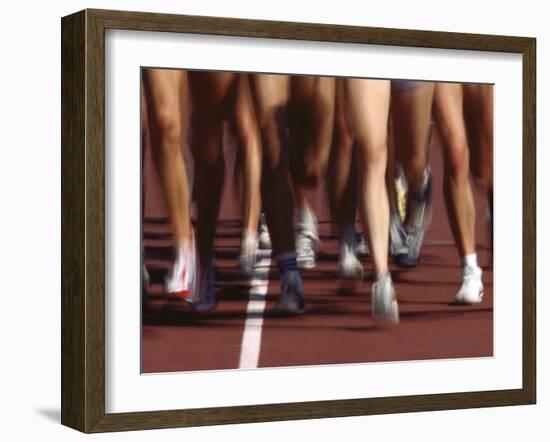 Blurred Action of Women Runners During a Track Race-Steven Sutton-Framed Photographic Print