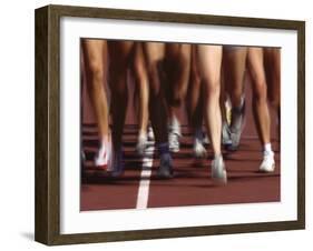 Blurred Action of Women Runners During a Track Race-Steven Sutton-Framed Photographic Print