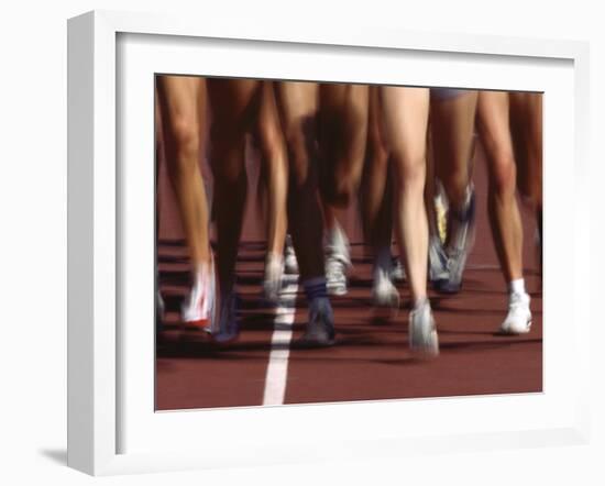 Blurred Action of Women Runners During a Track Race-Steven Sutton-Framed Photographic Print