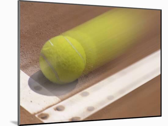 Blurred Image of a Tennis Ball Landing In Bounds-null-Mounted Photographic Print