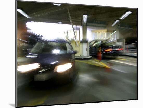 Blurred Image of Cars in a Parking Garage-null-Mounted Photographic Print
