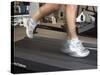 Blurred Image of Legs on a Treadmill-null-Stretched Canvas