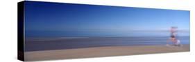 Blurred Motion, Side Profile of a Woman Running on the Beach-null-Stretched Canvas