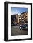 Boat at Sunset in Front of Apartment Building-David Barnes-Framed Photographic Print