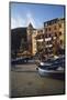 Boat at Sunset in Front of Apartment Building-David Barnes-Mounted Photographic Print