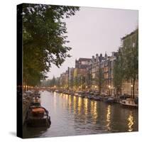 Boat Lined Canal at Dusk, Amsterdam, Netherlands-Marilyn Parver-Stretched Canvas