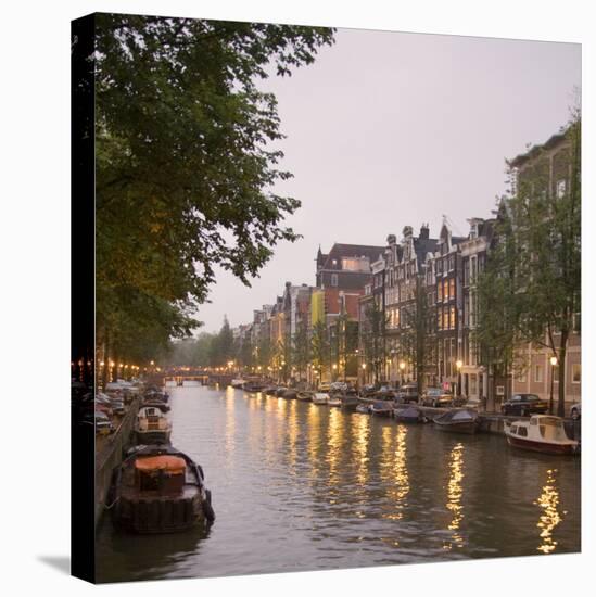 Boat Lined Canal at Dusk, Amsterdam, Netherlands-Marilyn Parver-Stretched Canvas