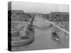 Boat on Aldebaran Canal Passing Houses in Venice, California-null-Stretched Canvas