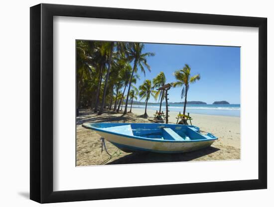 Boat on the Palm-Fringed Beach at This Laid-Back Village and Resort-Rob Francis-Framed Photographic Print