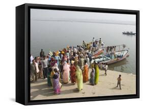 Boat on the River Ganges While a Cremation Takes Place, Varanasi, Uttar Pradesh State, India-Tony Waltham-Framed Stretched Canvas