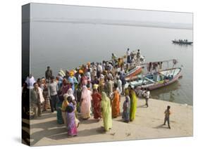 Boat on the River Ganges While a Cremation Takes Place, Varanasi, Uttar Pradesh State, India-Tony Waltham-Stretched Canvas