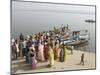 Boat on the River Ganges While a Cremation Takes Place, Varanasi, Uttar Pradesh State, India-Tony Waltham-Mounted Photographic Print