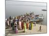 Boat on the River Ganges While a Cremation Takes Place, Varanasi, Uttar Pradesh State, India-Tony Waltham-Mounted Photographic Print