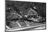 Boat Rests against A House Aft Hurricane-null-Mounted Photographic Print