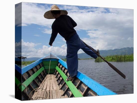 Boatman rowing boat with distinctive one-legged stroke on Inle Lake, Shan State, Myanmar-null-Stretched Canvas