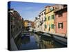 Boats and Colorful Reflections of Homes in Canal, Burano, Italy-Dennis Flaherty-Stretched Canvas