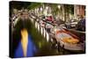 Boats in the Canal Near the Zuiderkerk Church in Amsterdam, Netherlands-Carlo Acenas-Stretched Canvas