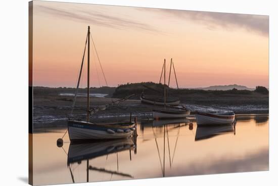 Boats in the channel on a beautiful morning at Burnham Overy Staithe, Norfolk, England, United King-Jon Gibbs-Stretched Canvas