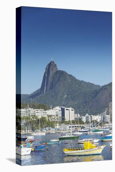 Boats Moored in Harbour with Christ the Redeemer Statue in Background, Urca, Rio de Janeiro, Brazil-Ian Trower-Stretched Canvas